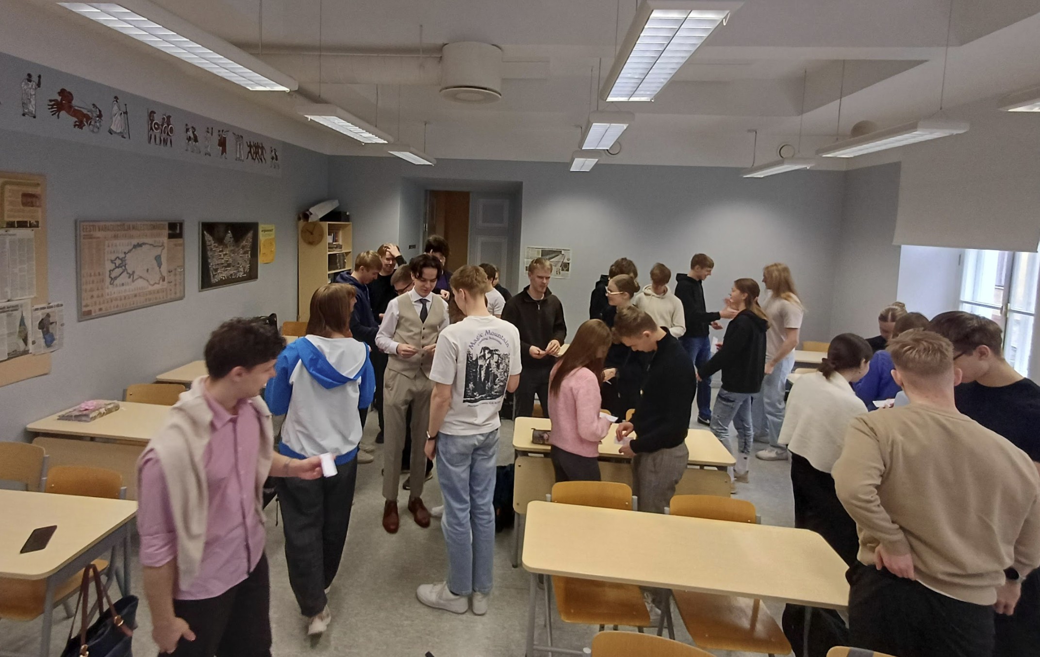 a group of students in a classroom, in discussion